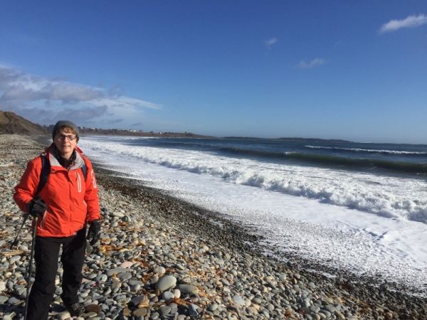 A woman hiking by the sea A woman hiking by the sea